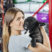 Portrait Of Woman Kissing French Bulldog At Store